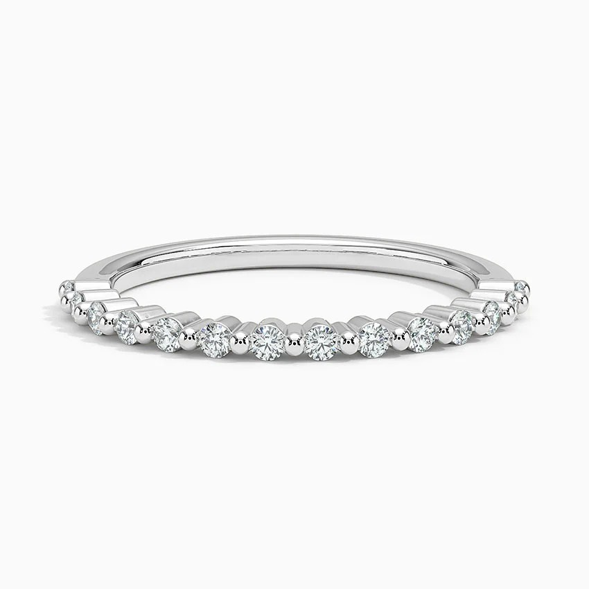 Silver ring with small diamonds on a white background