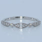 WG ring with diamond accents on a light gray background