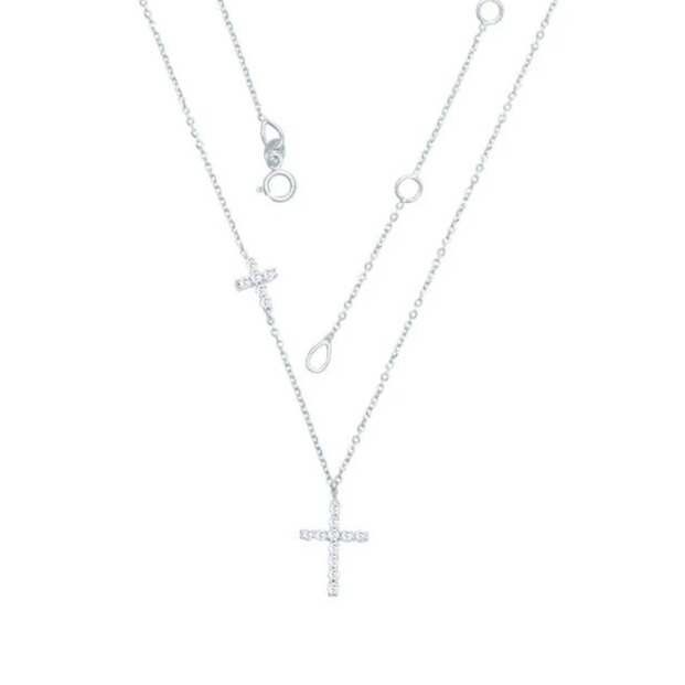 Silver necklace with cross pendant on a white background