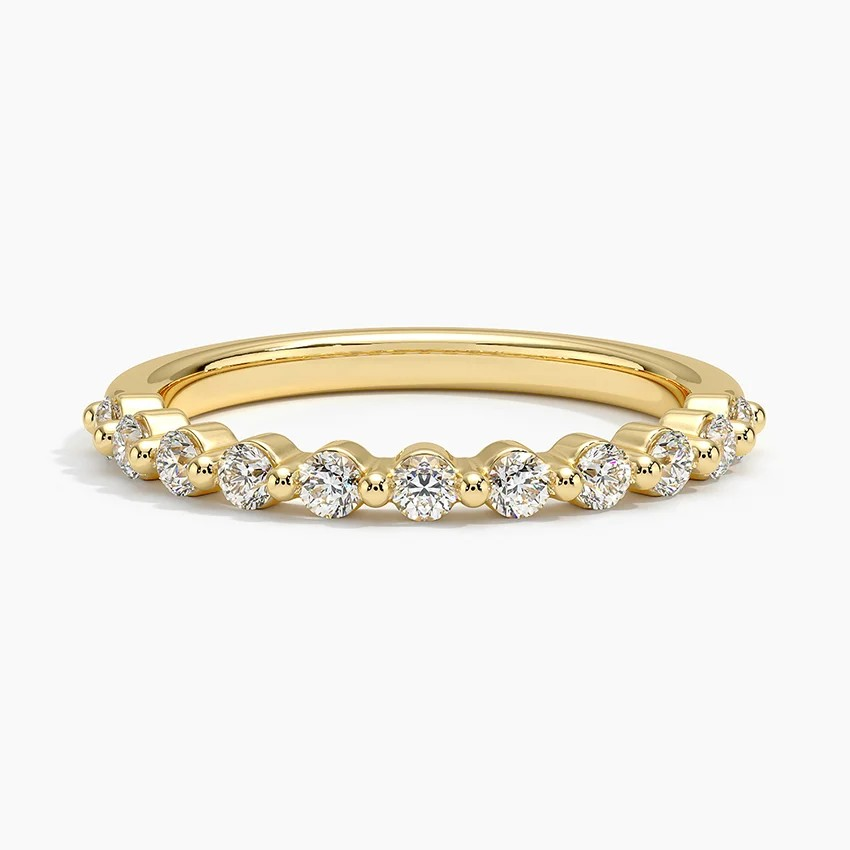 Gold ring with diamonds on a white background