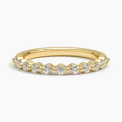 Gold ring with diamonds on a white background
