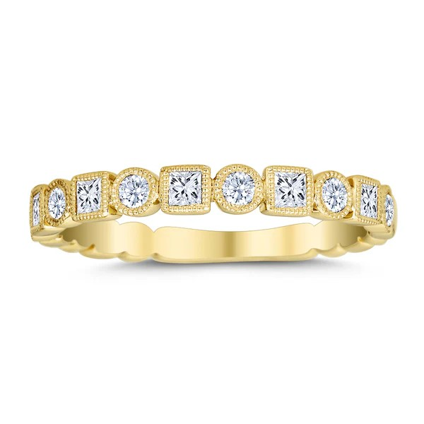 Gold ring with diamonds on a white background
