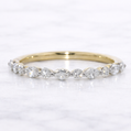 Gold ring with diamonds on a white background