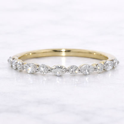 Gold ring with diamonds on a white background