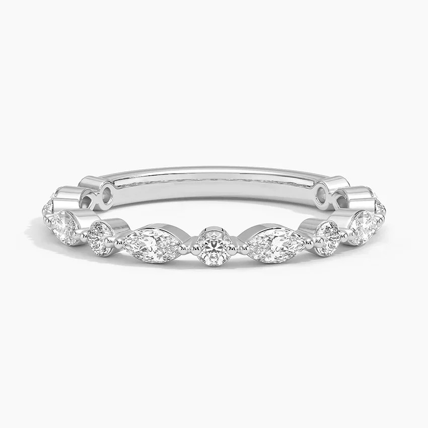 Silver ring with diamond accents on a white background