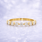 Gold ring with diamonds on a light purple background 14K Gold | .49ct Natural Diamond Round Half Eternity Band Shared Prong Wedding Band