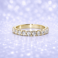 Gold ring with diamonds on a sparkling purple background 14K Gold | .91Cttw Half Eternity YG Lab Diamond Wedding Band