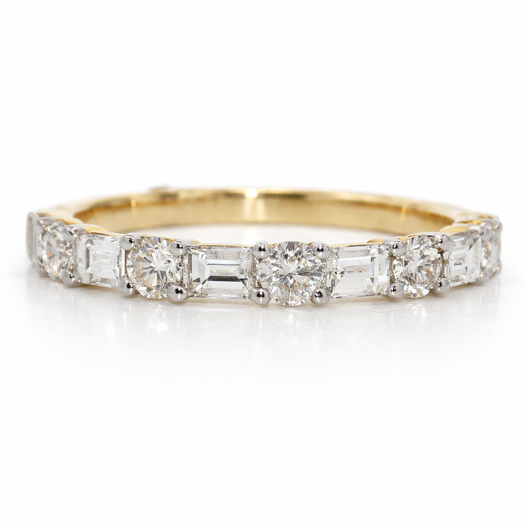 Gold ring with diamond stones on a white background
