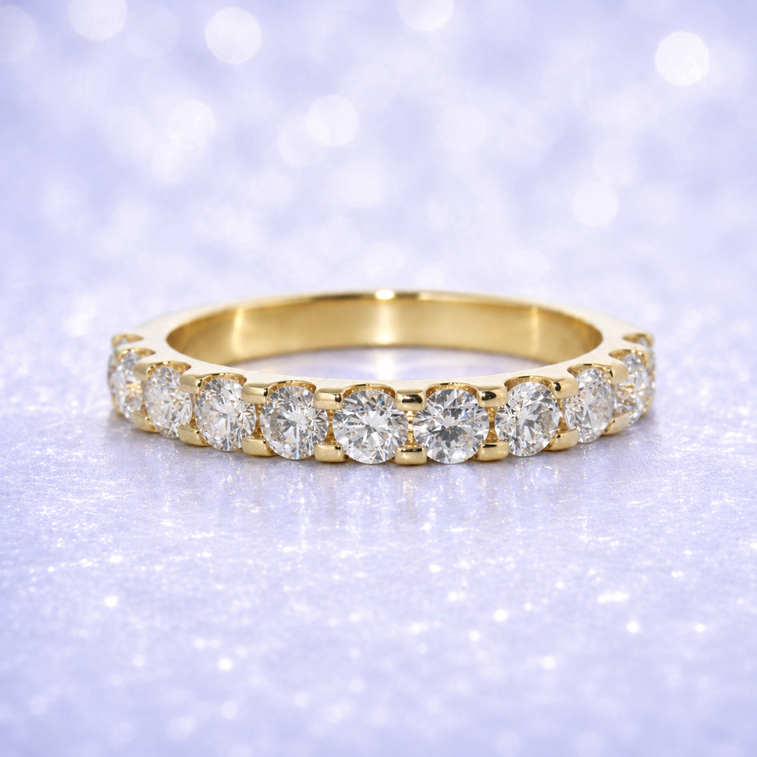 Gold ring with diamonds on a sparkling purple background 14K Gold | 1.52Cttw Half Eternity YG Lab Diamond Wedding Band