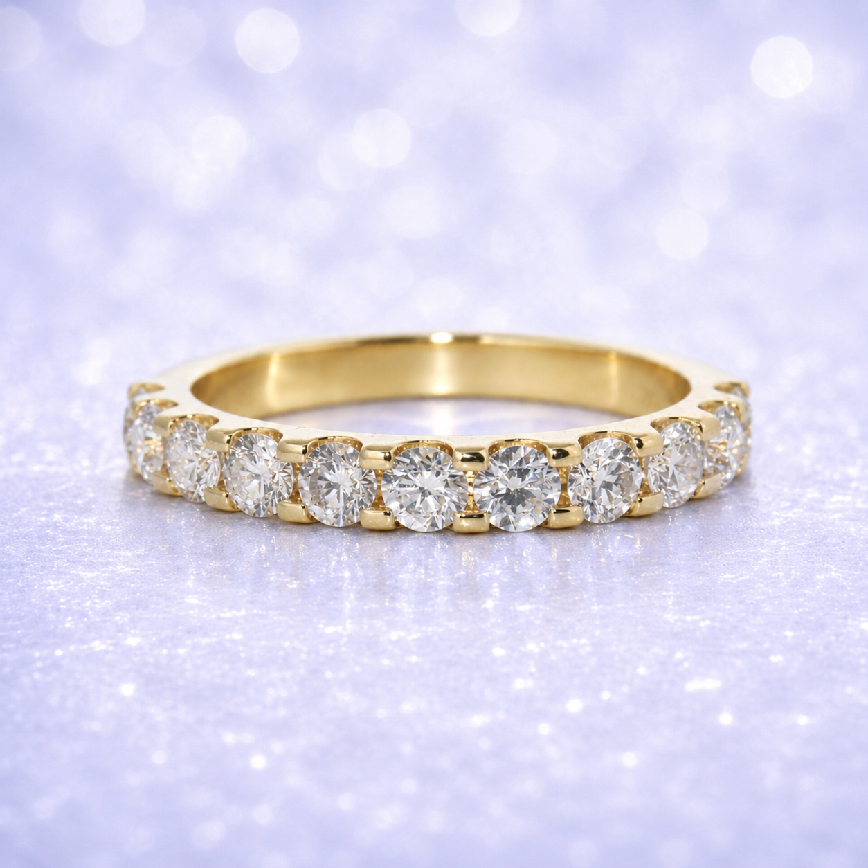 Gold ring with diamonds on a sparkling purple background 14K Gold | 1.52Cttw Half Eternity YG Lab Diamond Wedding Band