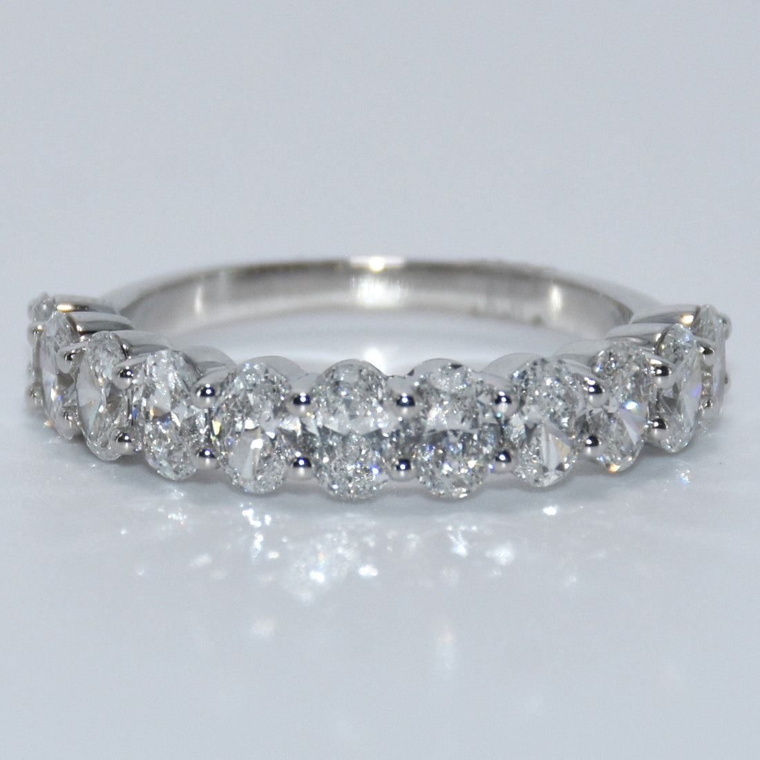 Diamond ring on a light gray background