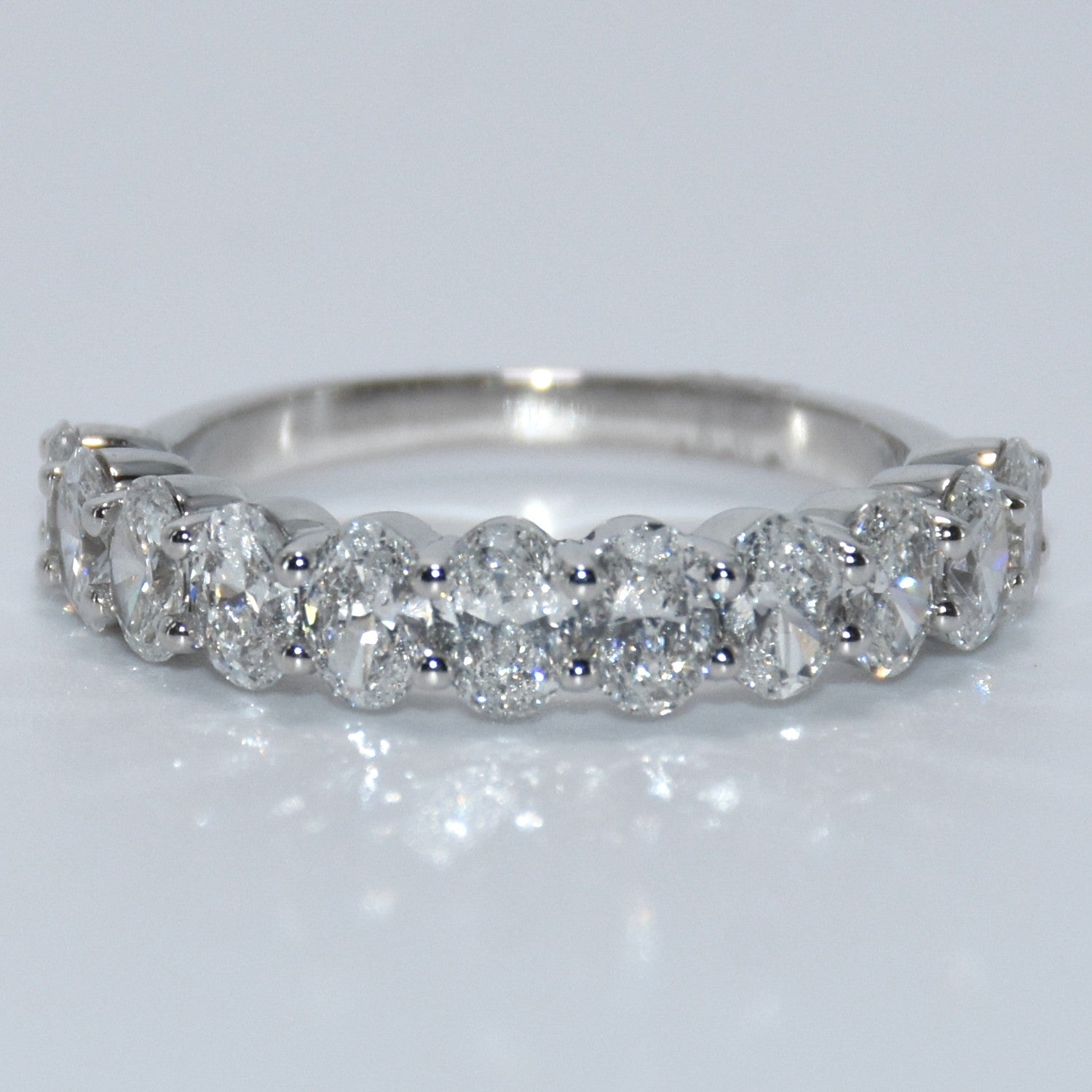 Diamond ring on a light gray background