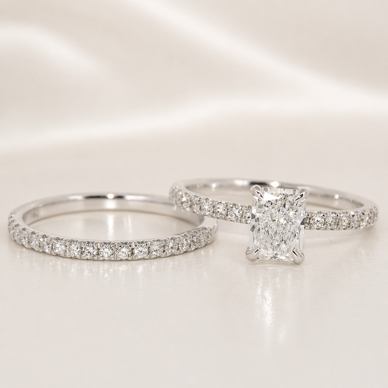 Two diamond rings on a light background