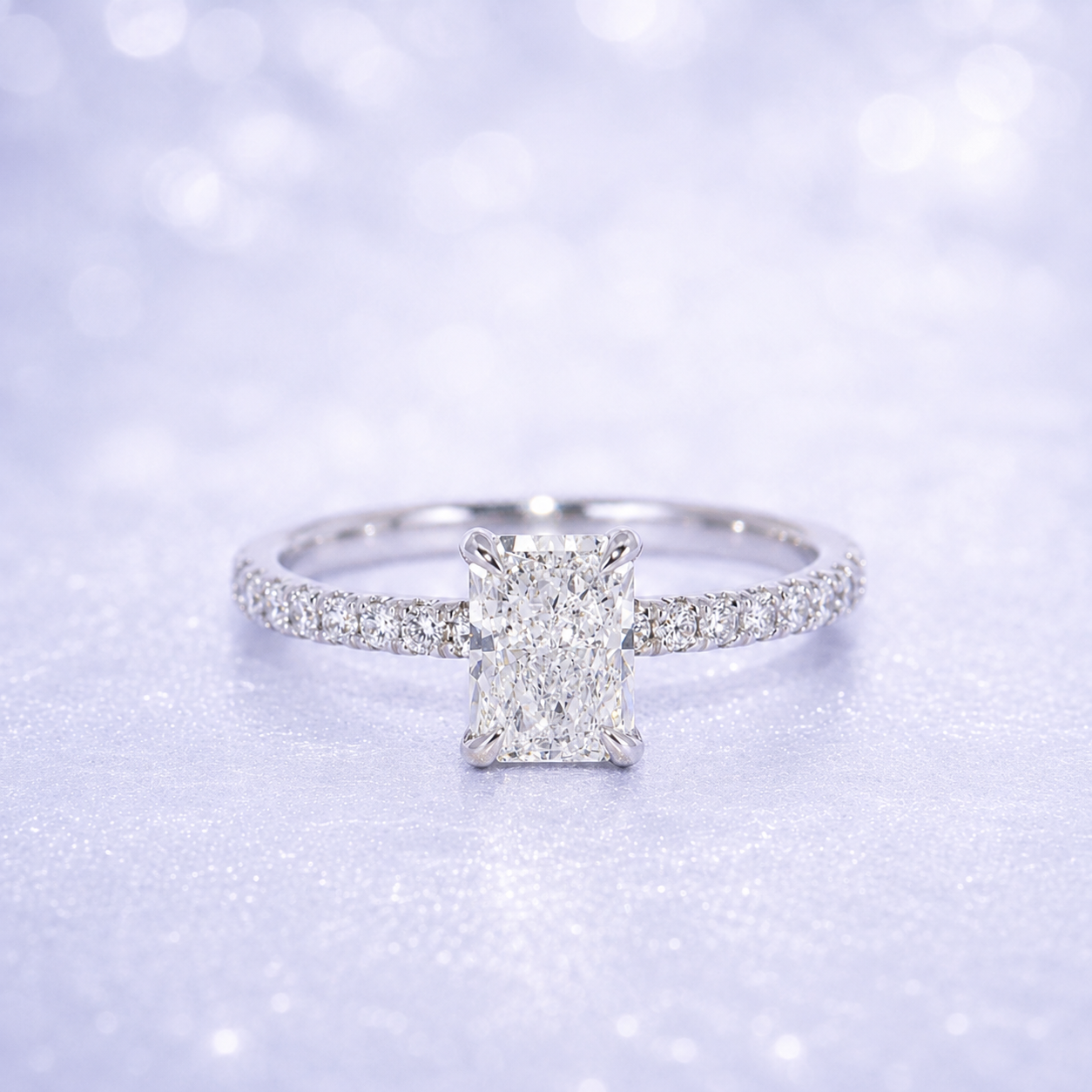 Diamond ring with a rectangular center stone on a sparkling background 14K Gold | 1CT Radiant Lab Grown Diamond Bridal Ring Set with Matching Wedding Band - White Gold 