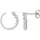 Diamond hoop earrings on a white background