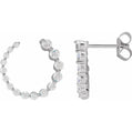Diamond hoop earrings on a white background