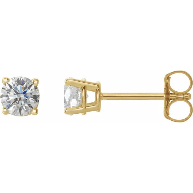 Gold stud earrings with clear gemstones on a white background