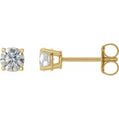 Gold stud earrings with clear gemstones on a white background