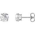 Pair of wg stud earrings with clear gemstones on a white background