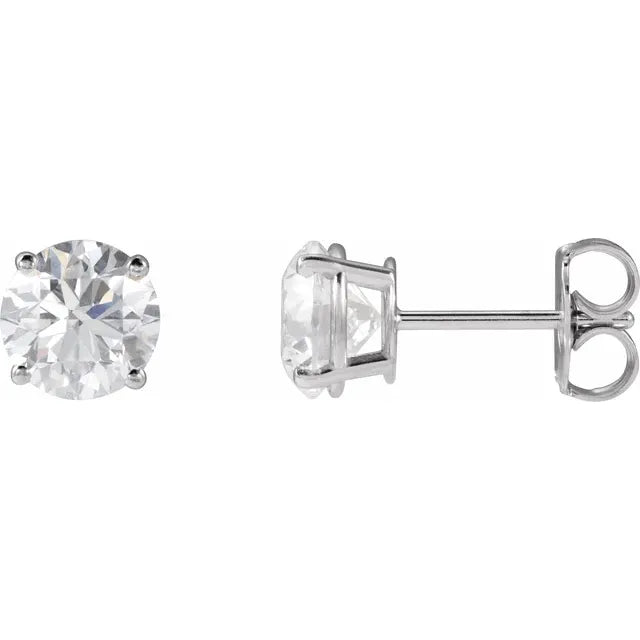Pair of wg stud earrings with clear gemstones on a white background
