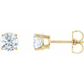 Gold stud earrings with clear gemstones on a white background