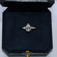 Diamond ring in a black jewelry box on a white background