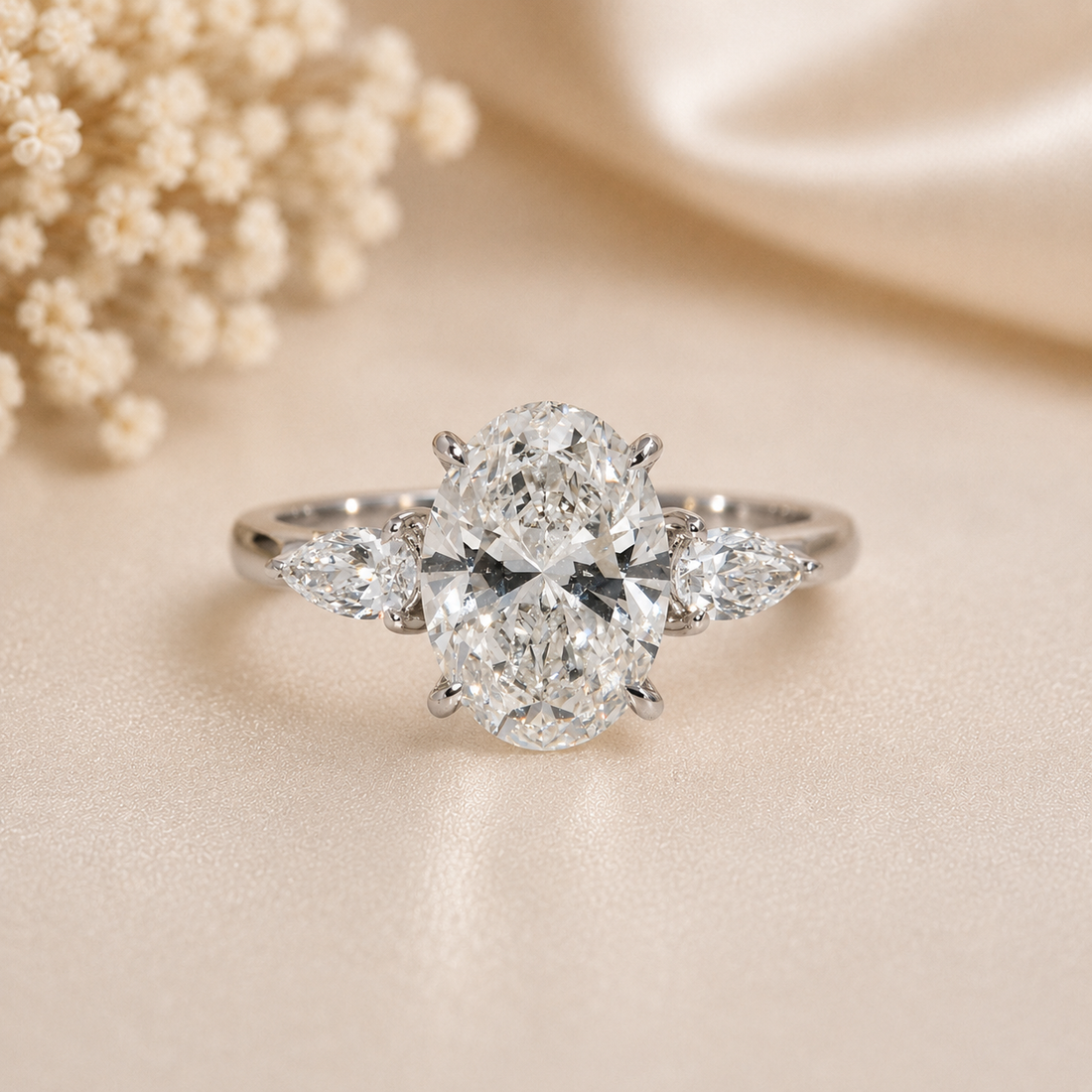 14K Gold | 3CT WG three-stone Oval Lab Diamond with Pear Side Stones Engagement Ring
