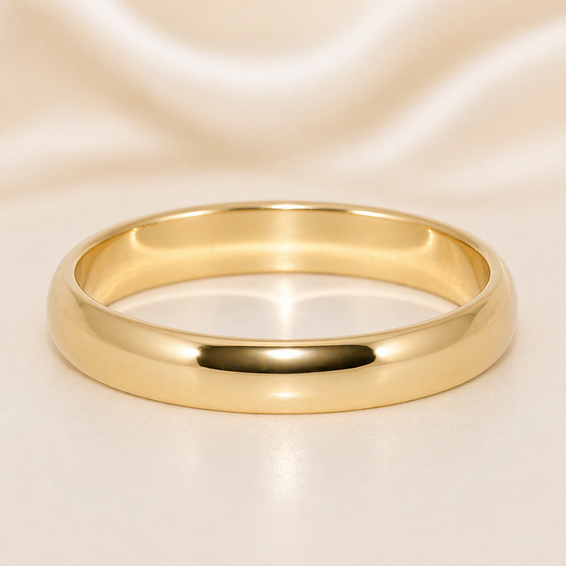 Gold ring on a soft beige background