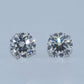 Pair of diamond stud earrings on a light gray background