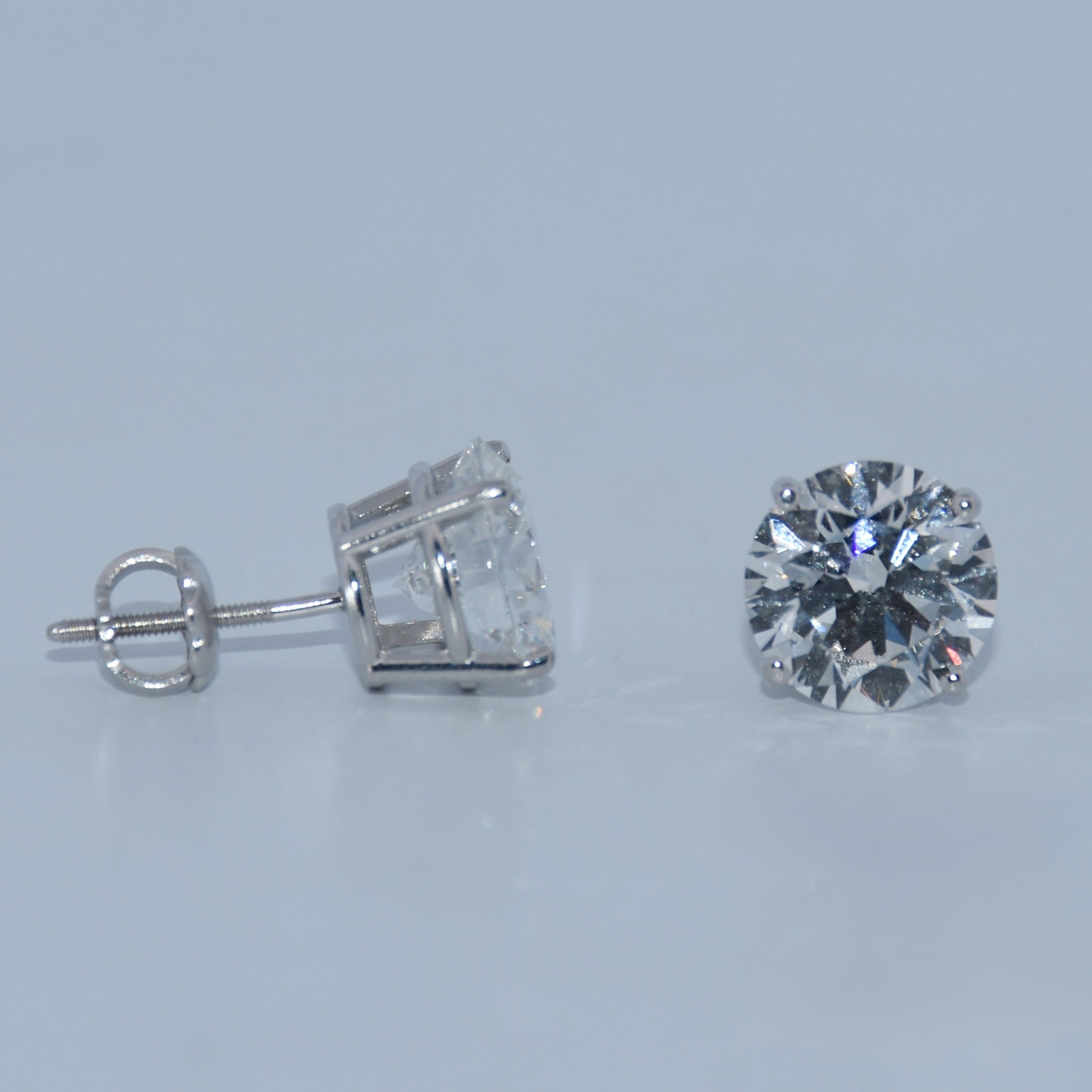Diamond stud earring on a light gray background