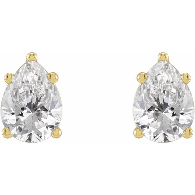 Pair of pear-shaped crystal stud earrings with gold accents on a white background