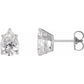 Two diamond earrings on a white background