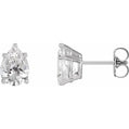 Two diamond earrings on a white background