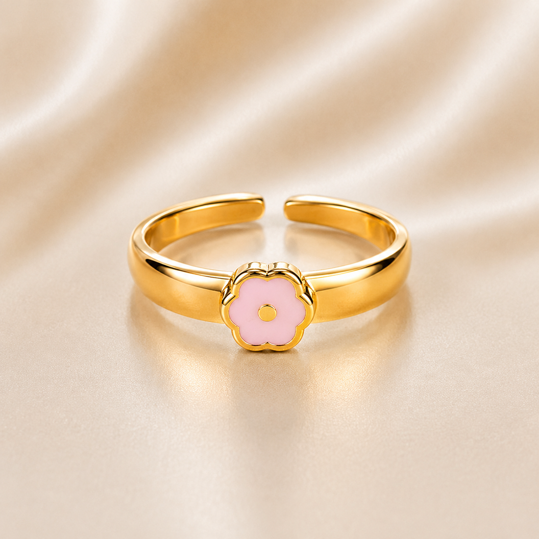 Gold ring with a pink flower-shaped center on a beige fabric background 14K Gold Adjustable Flower Toe Ring