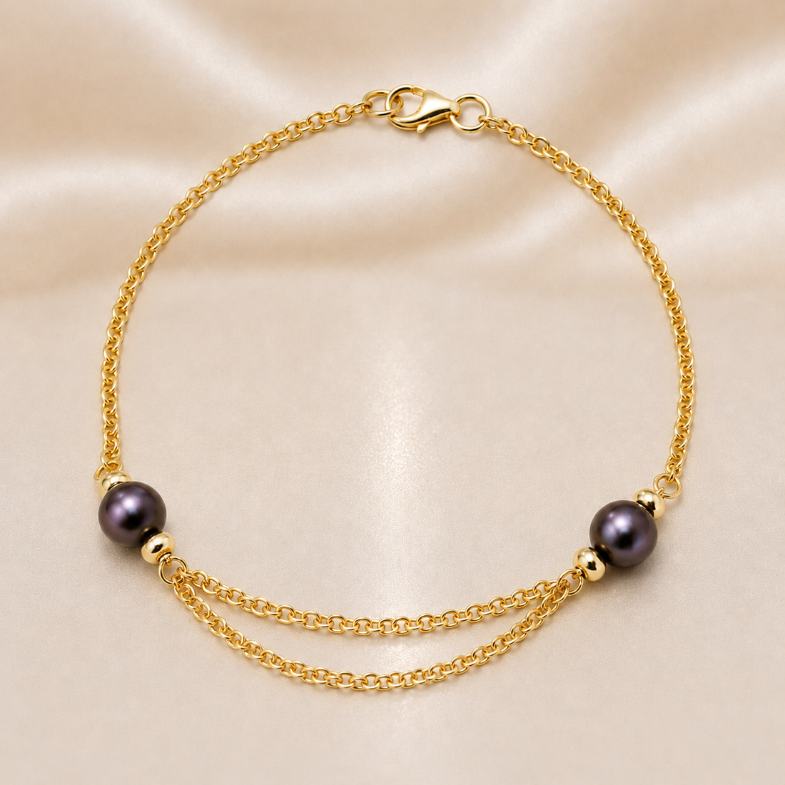 Gold bracelet with black pearls on a beige background 14K Gold | Black Pearl Chain Bracelet