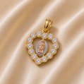 Gold pendant with heart design and central figure on a beige fabric background 14K Gold | CZ Heart Tricolor Virgin Mary Pendant