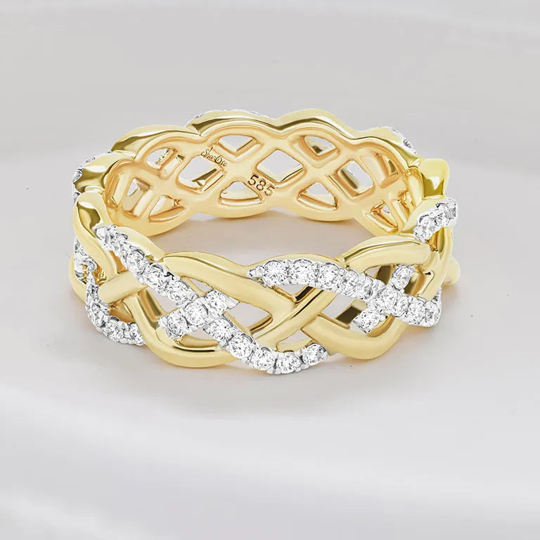 A yellow gold ring with an intricate braided lattice design, accented by rows of clear pavé diamonds along the braid. The inside of the band features a fine chain link pattern with a visible 'allmark. 14K Gold| Celtic Eternity Band with Lab Diamonds