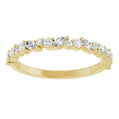 Gold ring with diamonds on a white background