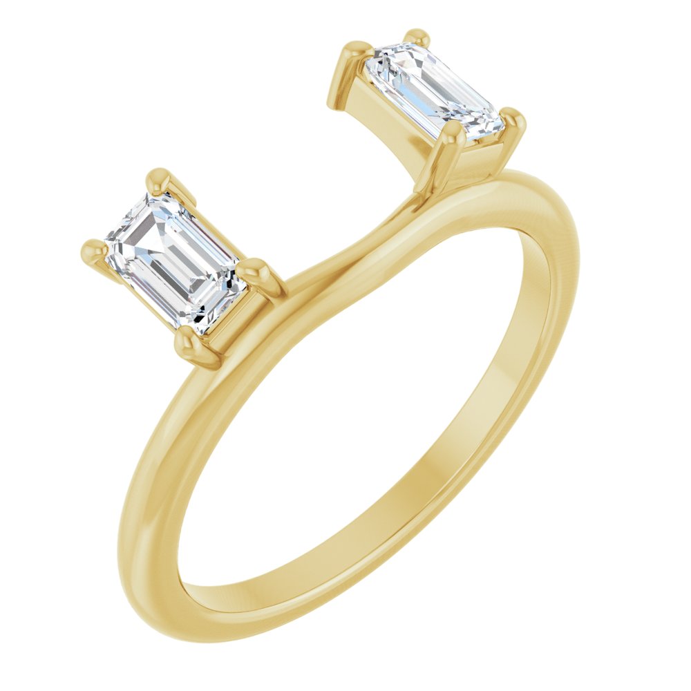 Gold ring with two emerald-cut diamonds on a white background