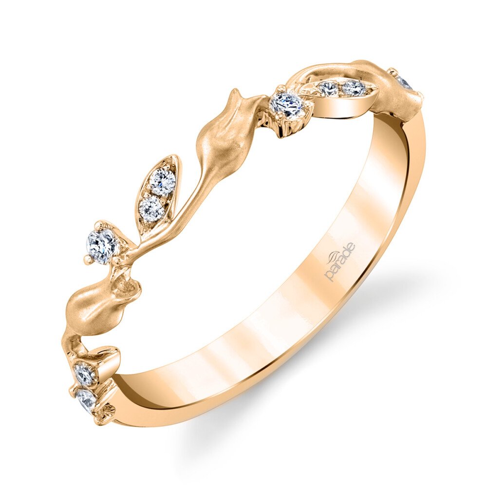 Gold ring with diamond accents on a white background