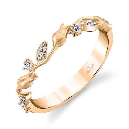 Gold ring with diamond accents on a white background