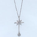 Silver star-shaped pendant necklace with two small diamonds on a light blue background