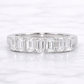 Diamond ring with baguette-cut stones on a white background