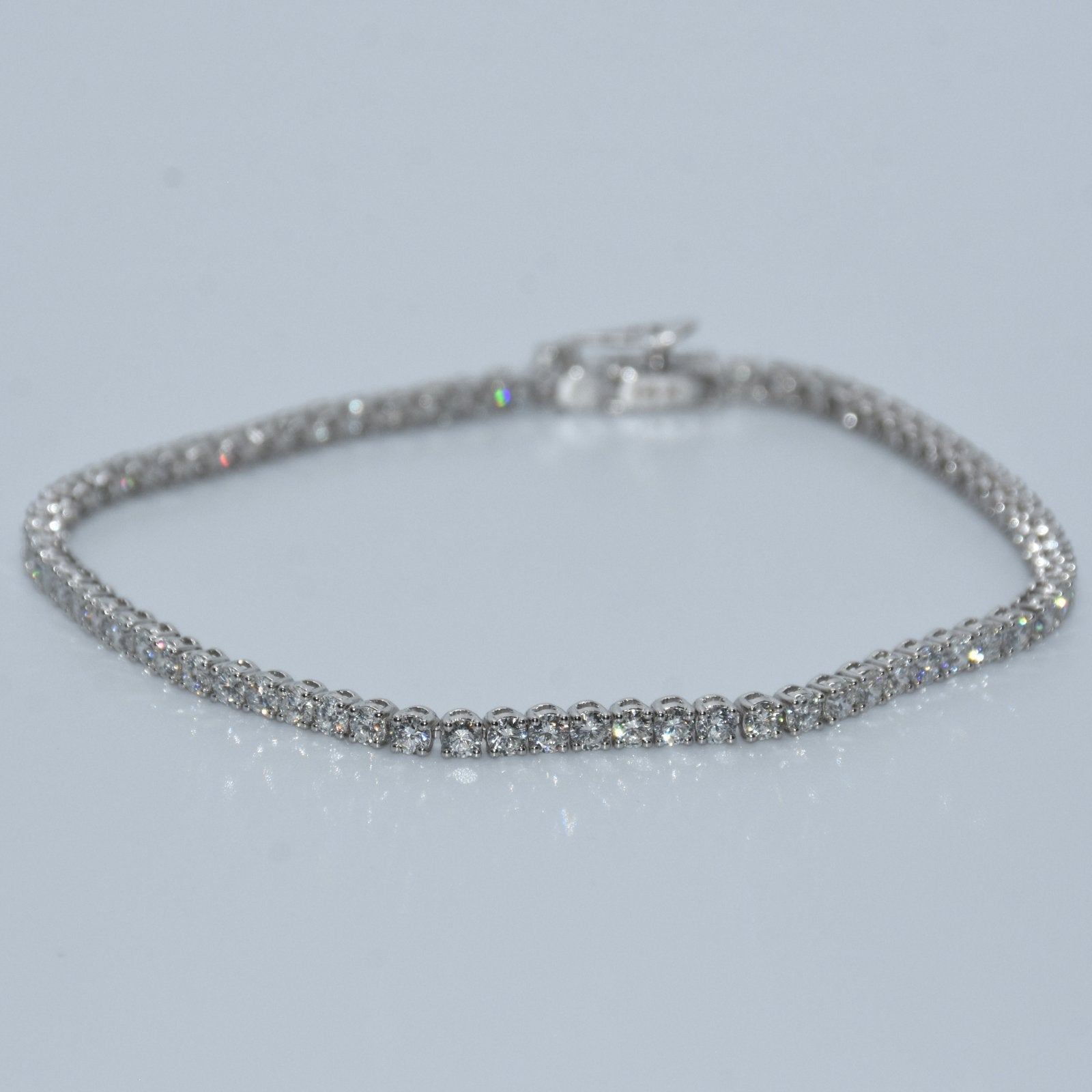 Silver bracelet on a light gray background