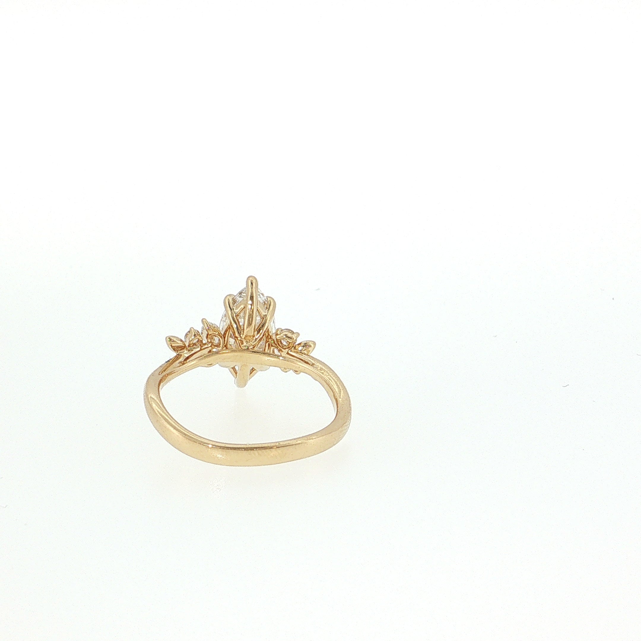 Gold ring with a decorative design on a white background 14K Gold | YG 1.56ct Lab Marquise w/ .10ct Natural Round & .12ct Marquise Diamond Accents Engagement Ring