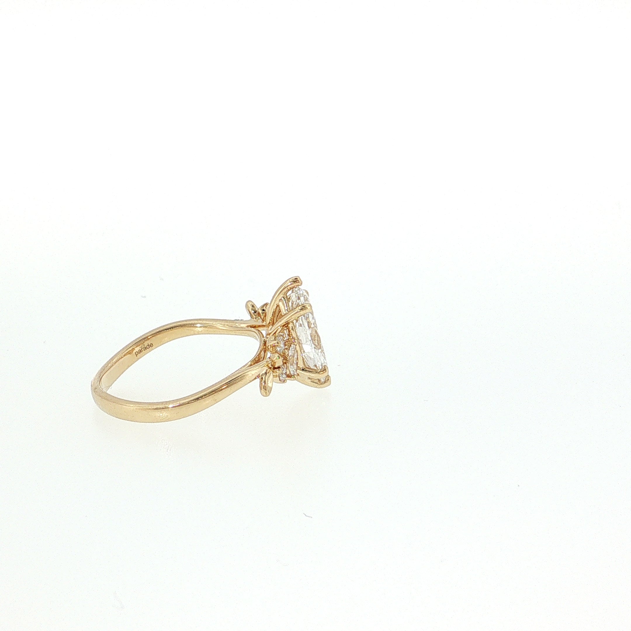 Gold ring with a diamond on a light beige background 14K Gold | YG 1.56ct Lab Marquise w/ .10ct Natural Round & .12ct Marquise Diamond Accents Engagement Ring