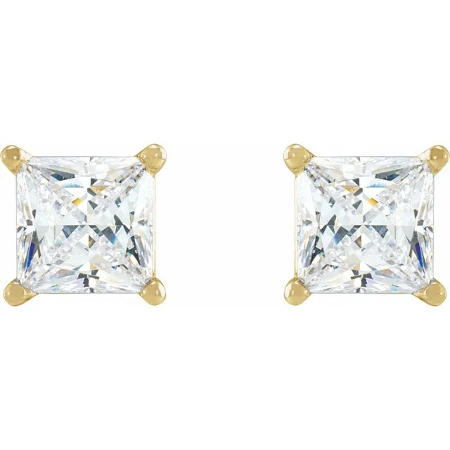 Gold earrings with clear gemstones on a white background