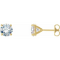Gold stud earrings with clear gemstones on a white background
