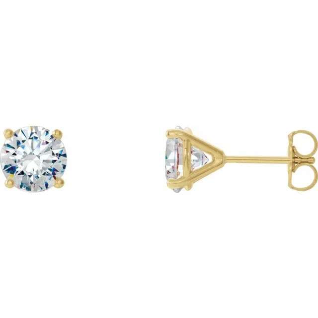 Gold stud earrings with clear gemstones on a white background