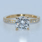 Gold ring with a diamond on a light gray background